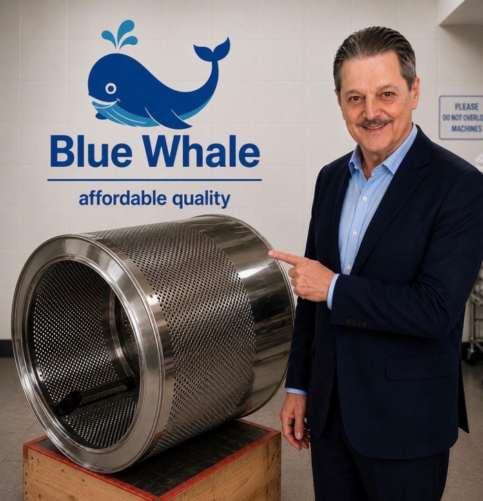Larry Larsen pointing to the drum of a Blue Whale washer, affordable quality